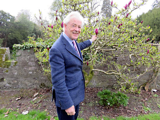 the 7th Earl of Rosse, Brendan Parsons, pointing to a flower