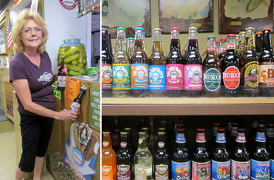 Old Town Root Beer owner, Cory Montgomery and some of the over 500 varieties of root beer at her store