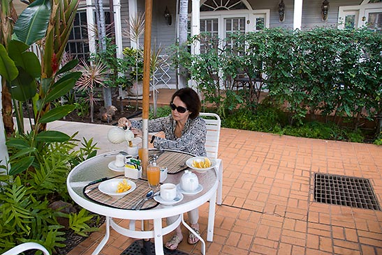 a guest enjoying breakfast at the Plantation Inn prepared by Gerard's