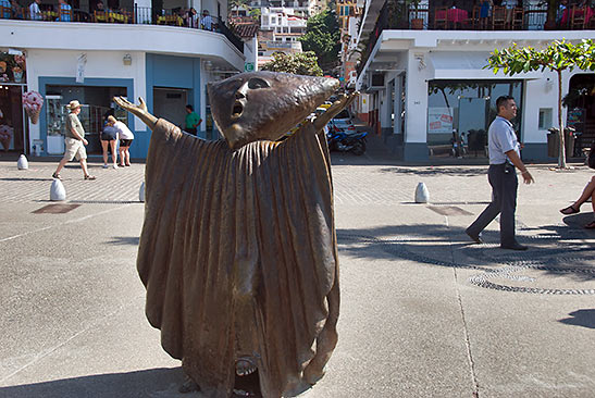 sculpture-laden malecon on a Puerto Vallarta cobbled street