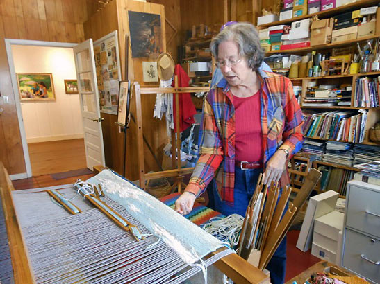 Nancy Garretson demonstrating weaving art at the Arts Depot in Abingdon