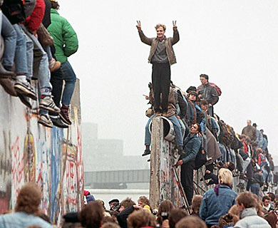 East and West Berliners breaking down portions of the Berlin Wall, 1989