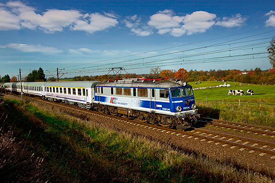 Eurail train passes through a Polish countryside
