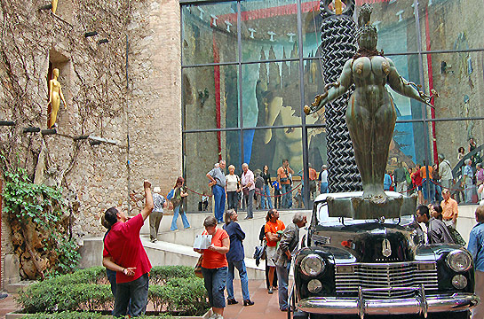 Salvadore Dali's Cadillac with bronze statue in front of the Dali Theatre-Museum, Figueres, Spain