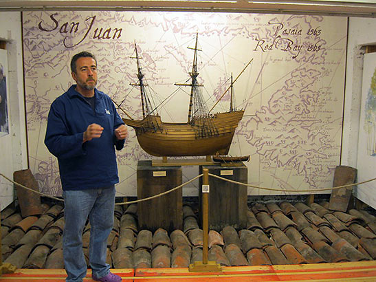 museum director with a model of SAN JUAN