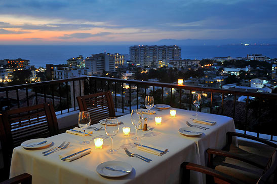 view of Puerto Vallarta and Banderas Bay during a late summer night from Vista Grill