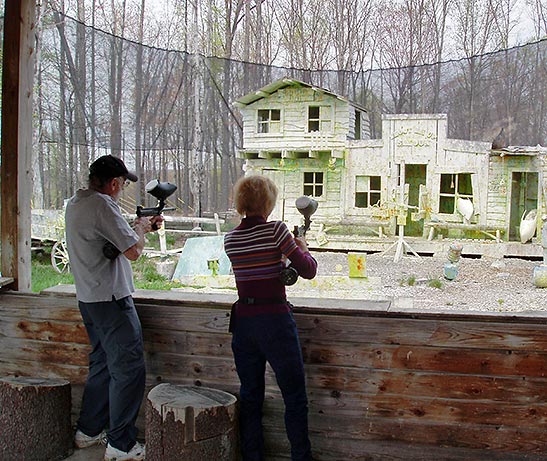 writer and her husband at Paintball Target Practice