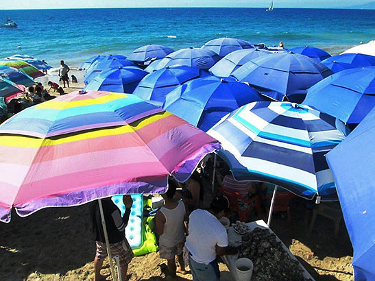 beach umbrellas at the end of the Malecon