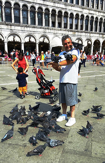 feeding pigeons at the Piazza San Marco