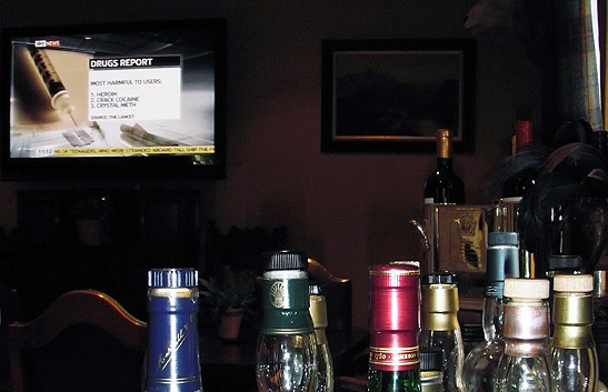 Sky News program on bar television with whiskey bottles in the foreground, Pittormie Castle