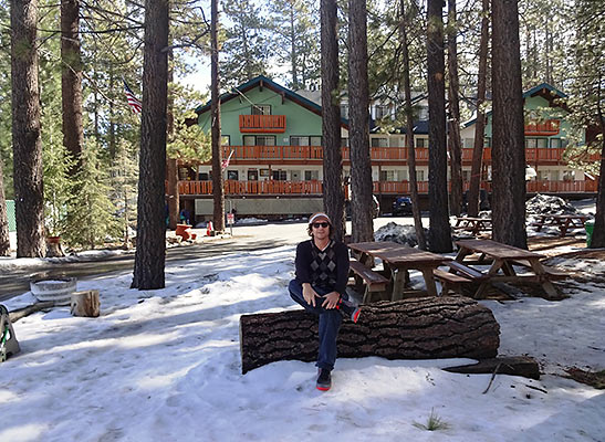 writer in front of the Honey Bear Lodge