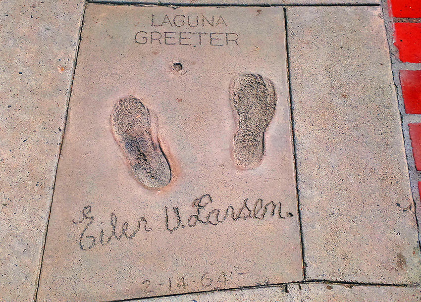 footprints of the Greeter, Eiler Larsen, on a sidewalk