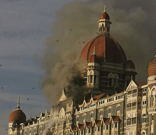 smoke billows from the Taj Mahal Hotel as it comes under terrorist attack, Nov. 2008