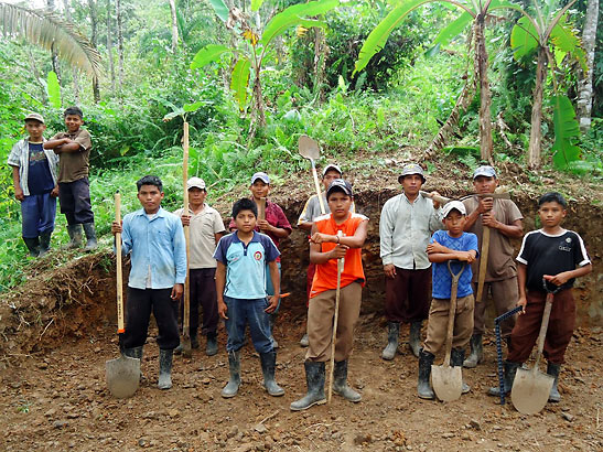 workers pose while leveling off land for storage tanks in Abajo community, Panama
