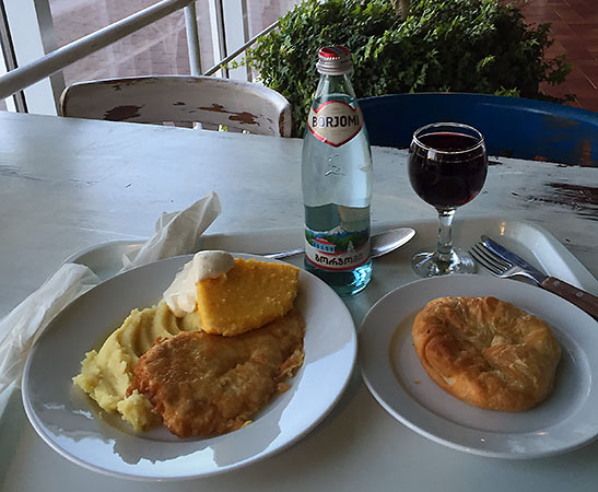 Moldovan meal served with polenta and wine