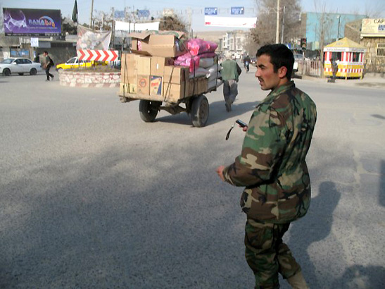 Afghan military man and Kabul street scene