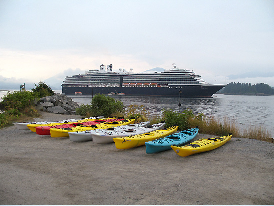 kayaks on the shore with the Holland America in the background