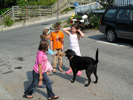 children with dog at a street in Juneau, Alaska