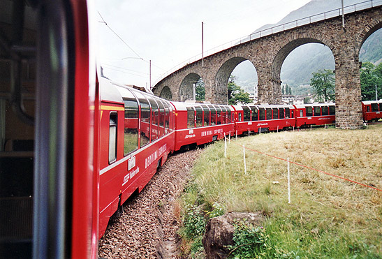 Bernina Express train going under the Brusio Viaduct