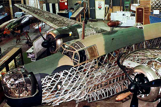 R for Robert Wellington bomber being restored