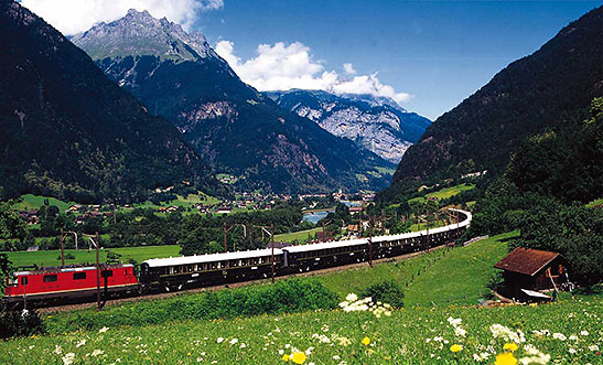 Orient Express train passing through beautiful countryside