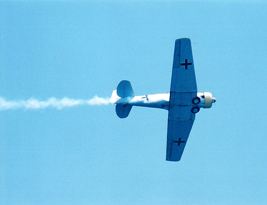 aircraft with German markings belching smoke