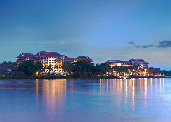 twilight at the Anantara Riverside Hotel with the Chao Phraya River in the foreground