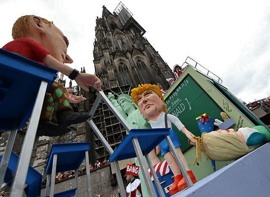a float featuring Trump, Putin, Hillary Clinton and the Statue of Liberty in a Cologne parade