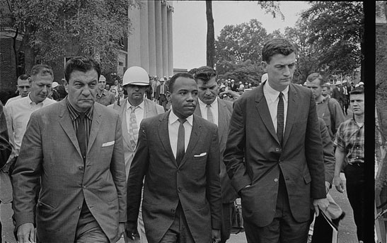 James Meredith, flanked by federal marshals, entering the University of Mississippi, 1962