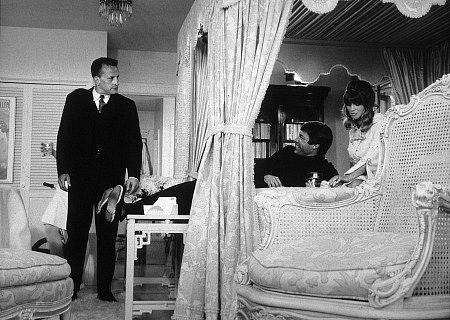 George C Scott watching Richard Chamberlain on the bed with Julie Christie in a scene from Petulia