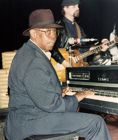 Pinetop Perkins performing on his piano