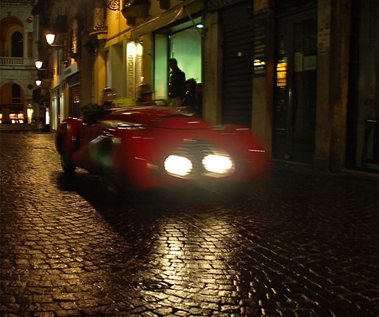 car speeding over Vicenza's ancient cobblestone streets the Mille Miglia or 1,000 Miles race