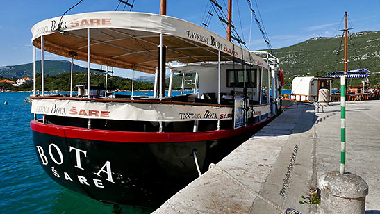 canopied fishing tug at the Bay of Mali Ston, Croatia