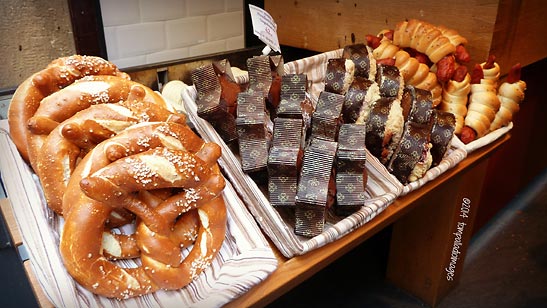 freshly made pretzels, gingerbread and piggies-in-a-blanket at a store in Prague