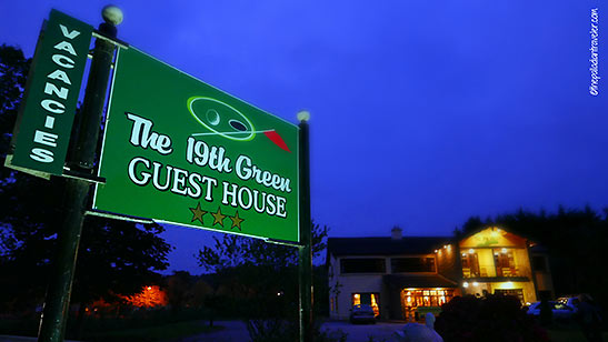 The 19th Green Guest House sign
