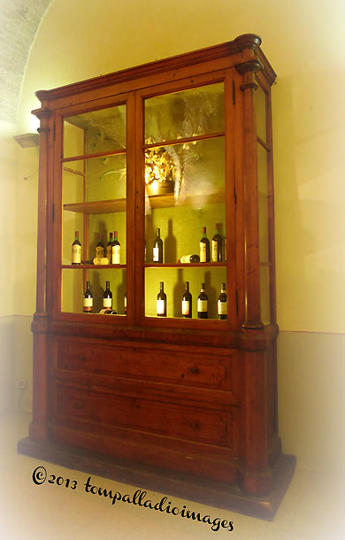 glass case of wines at the Tenuta Bichi Borghesi estate