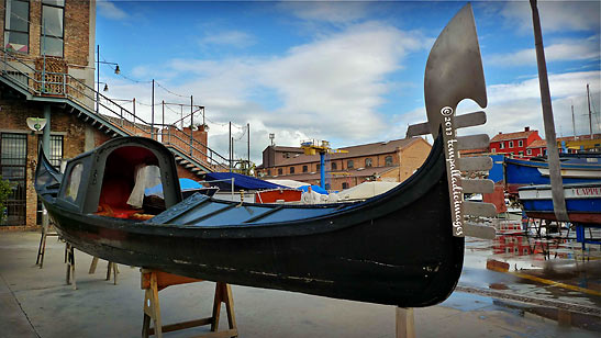 a gondola from the 1800s on display at the entryway to the Arti Veneziane alla Giudecca (AVG)