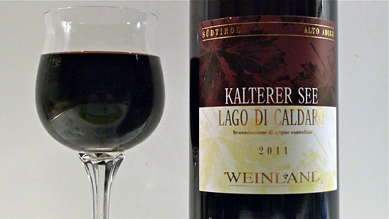 a glass and bottle of Kalterer See Weinland DOC
