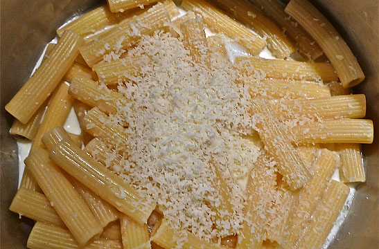 cheese added to pasta and cream