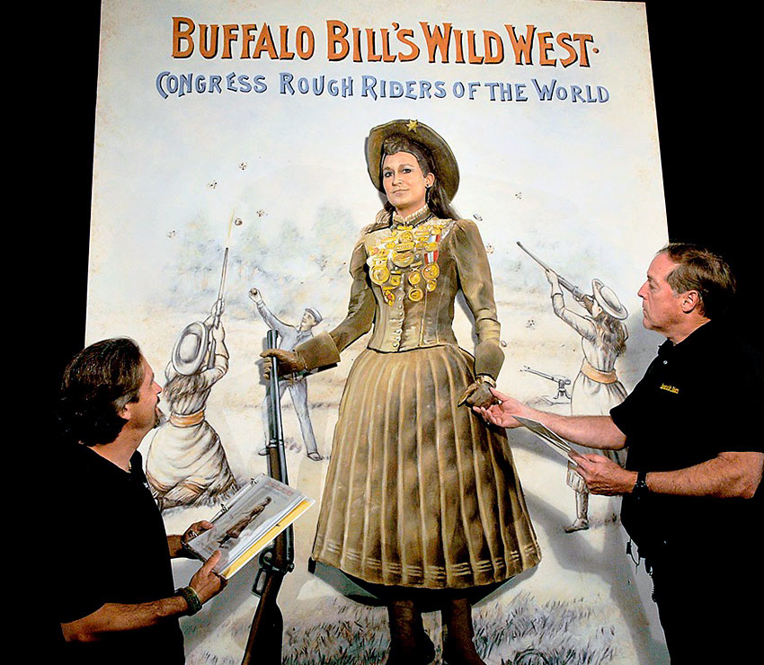 recreation of an Annie Oakley poster with a live motionless model