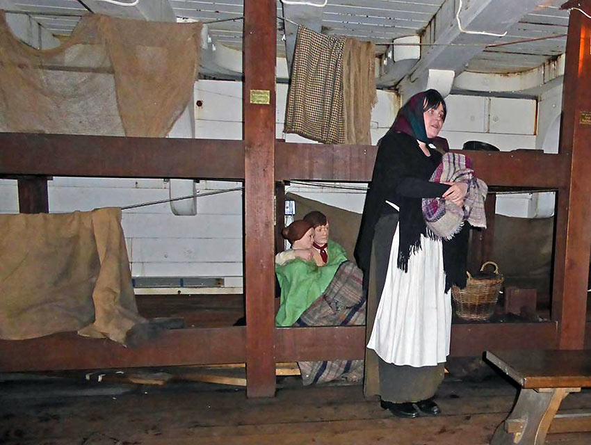 costumed enactor talks about living conditions during the crossing to America