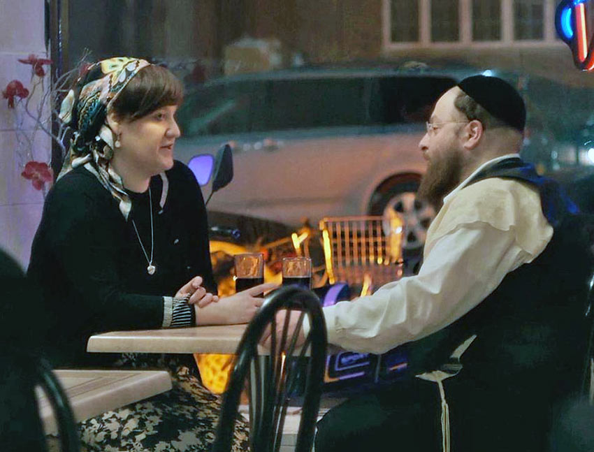 Menashe meets a woman recommended by the local matchmaker