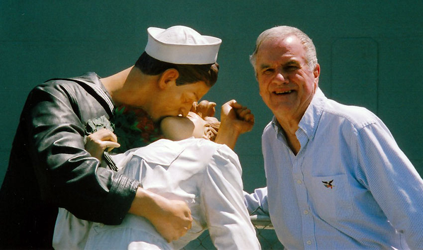 John Clayton with the statue of the kissing sailor in front of the USS Iowa in San Pedro, CA