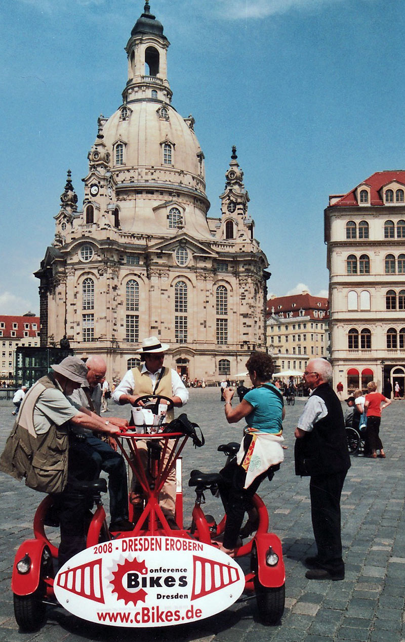 Bicycle for 7 with the Dresden Frauenkirche in the background