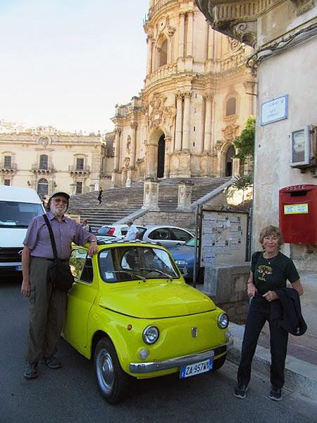 writer with vintage iconic Fiat 500