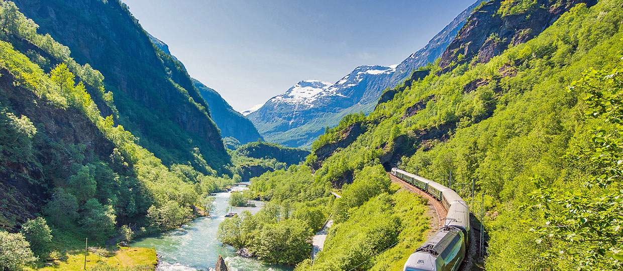 Flam Railway train running along the Flamsdalen Valley
