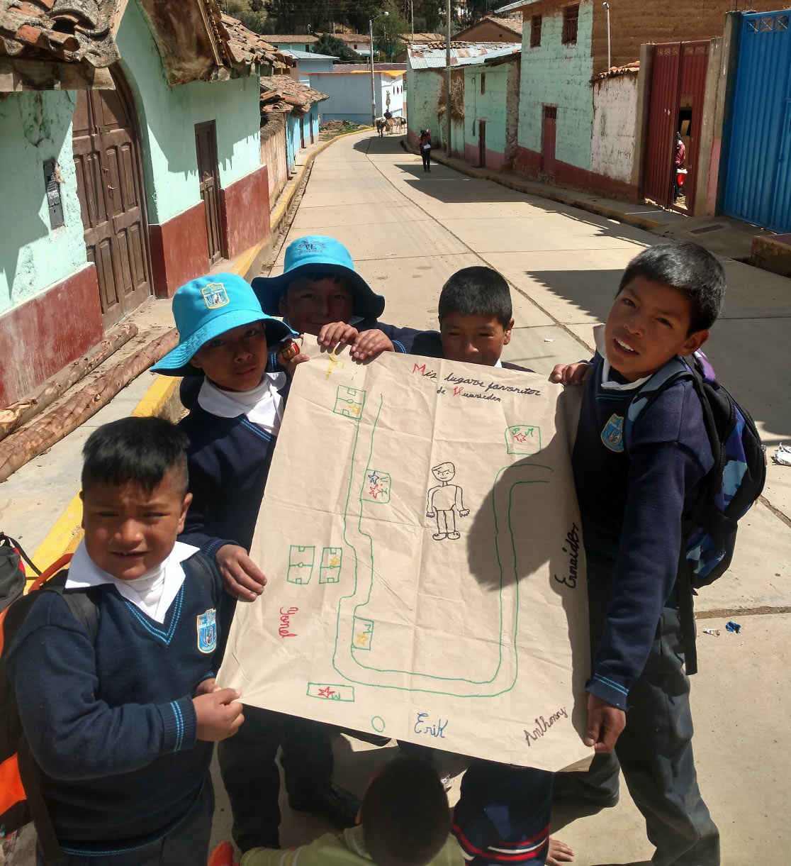 students from Premaria help the writer prepare a community map