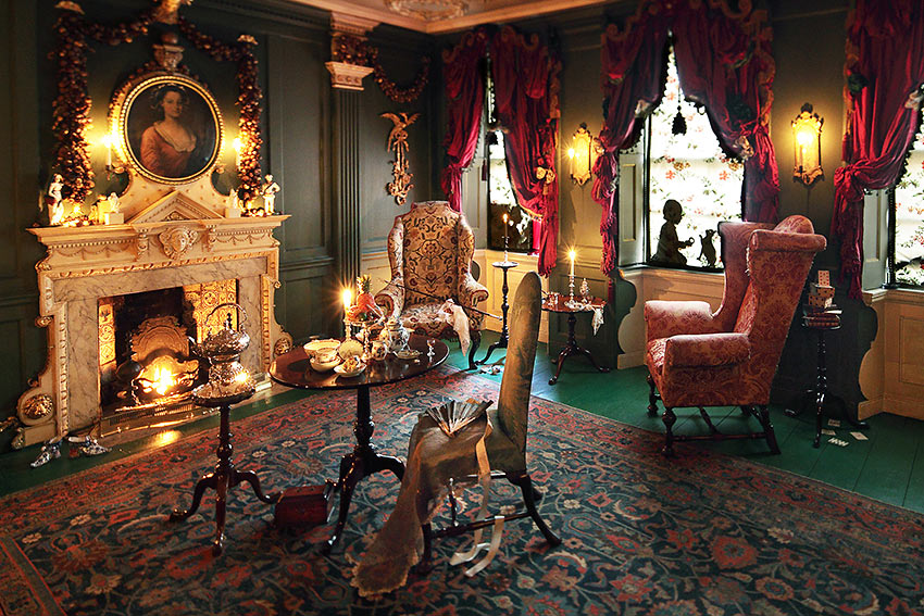 The Living Room filled with original, true-to-the 1800 period furniture and a real fire in the hearth