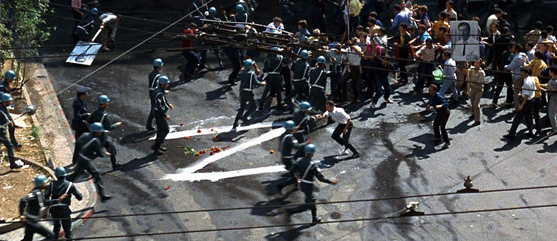 a clash between demonstrators and police: a scene from the movie Z