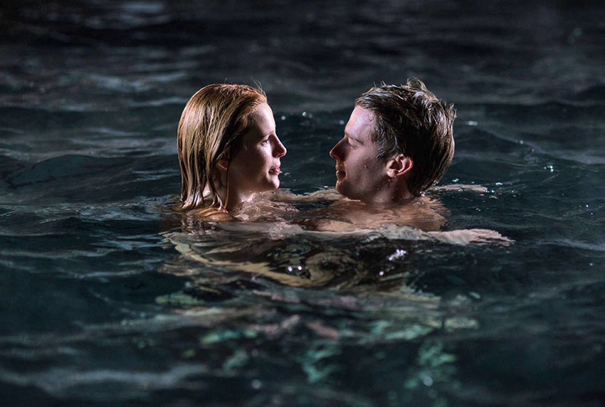 Bella Thorne and Patrick Schwarzenegger in a romantic moonlight swim